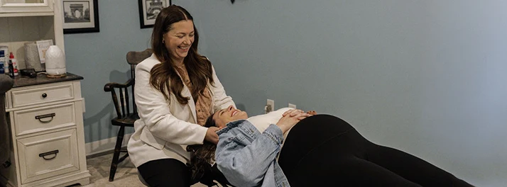 Chiropractor Kenosha WI DoniBeth Davis Adjusting Pregnant Woman (1)
